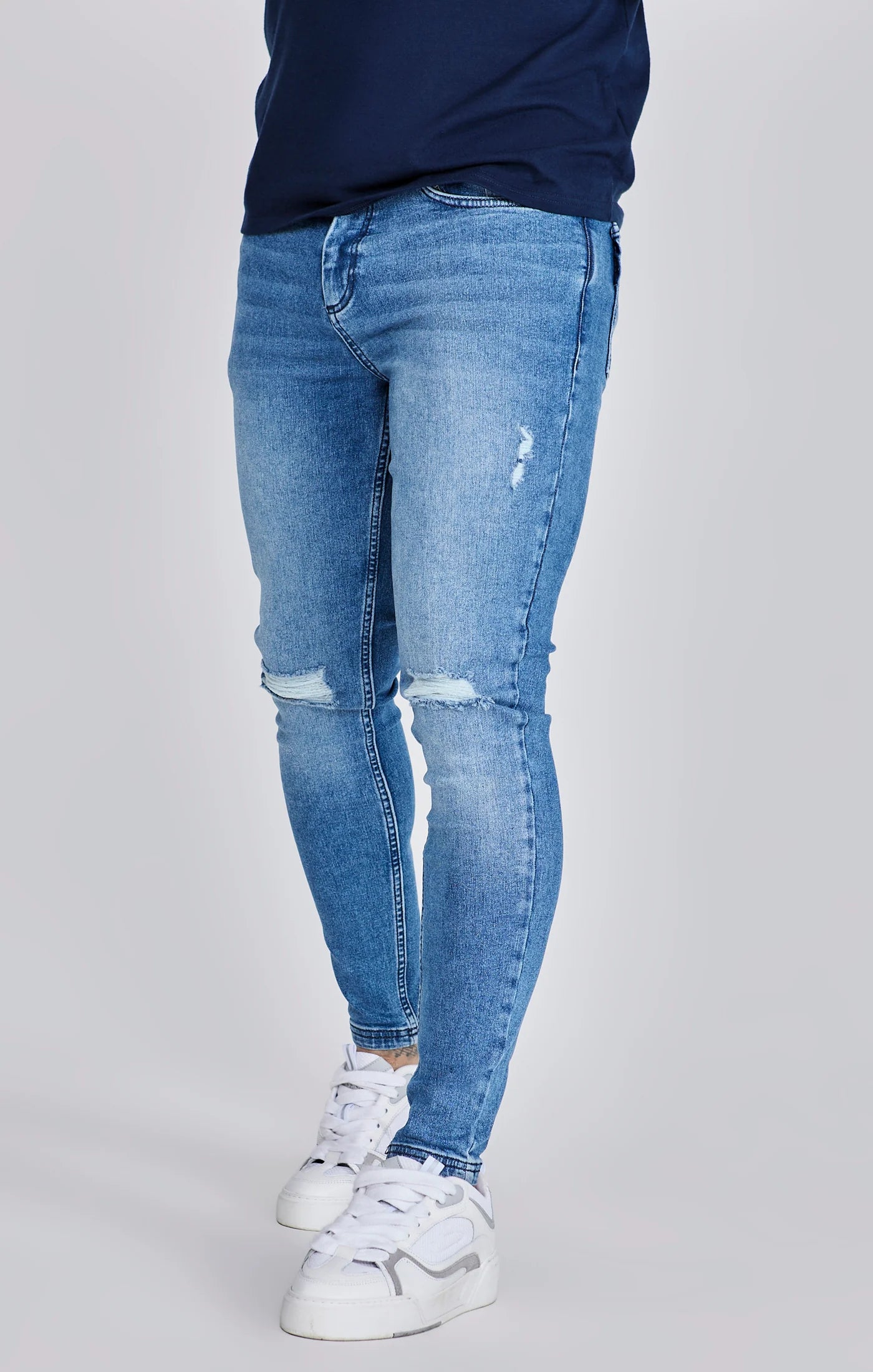 Jeans delgados angustiados azules Siksilk