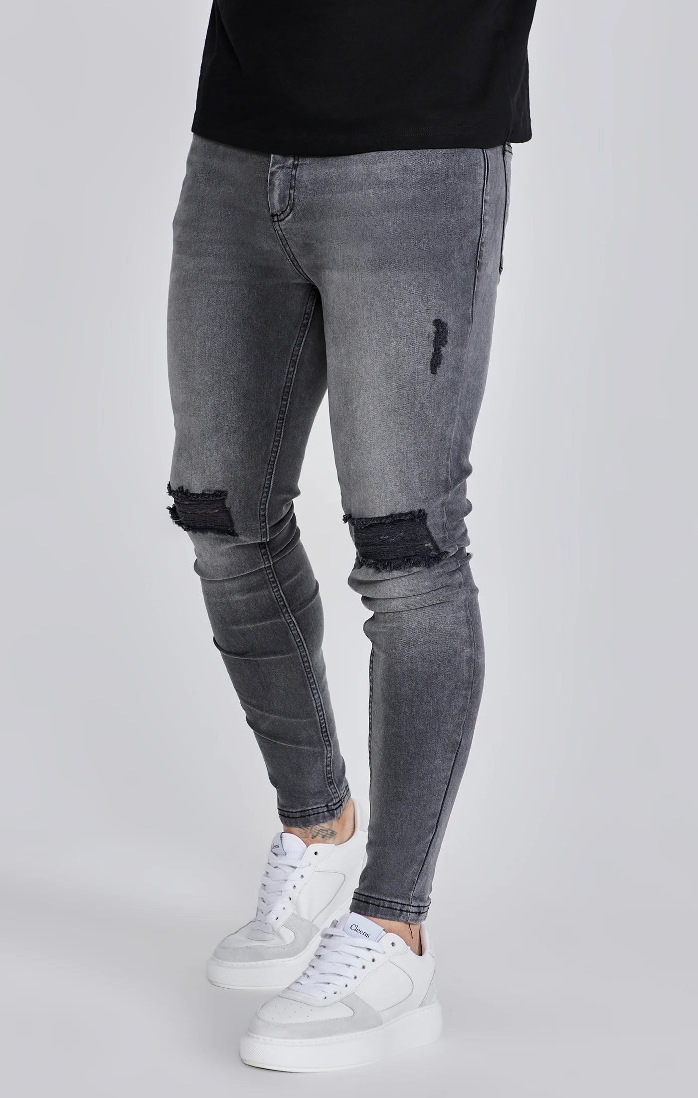 Jeans delgados angustiados grises Siksilk