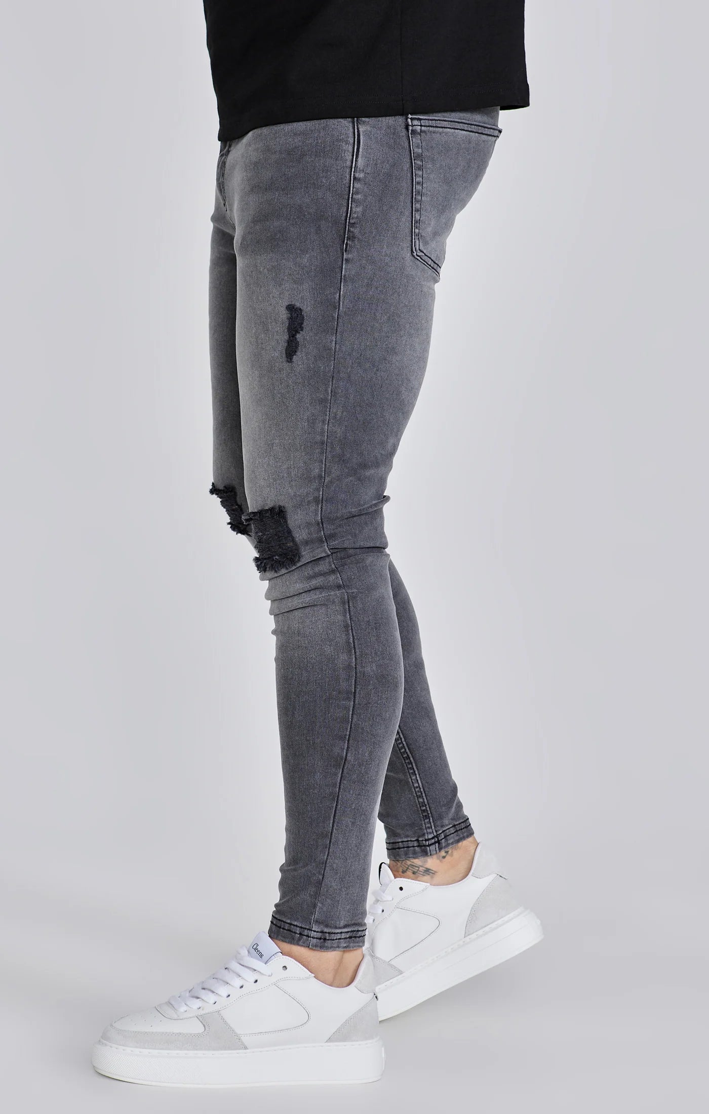 Jeans delgados angustiados grises Siksilk