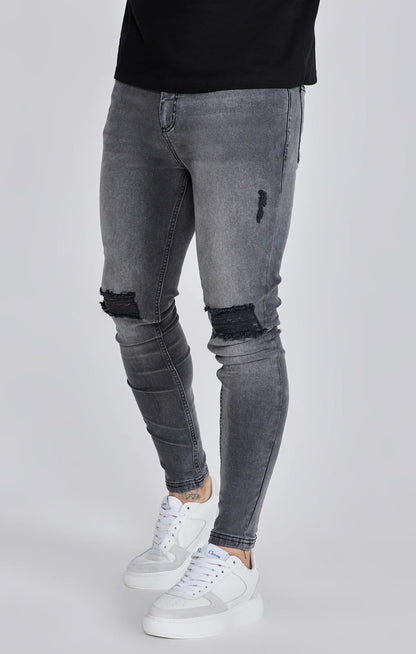 Jeans delgados angustiados grises Siksilk