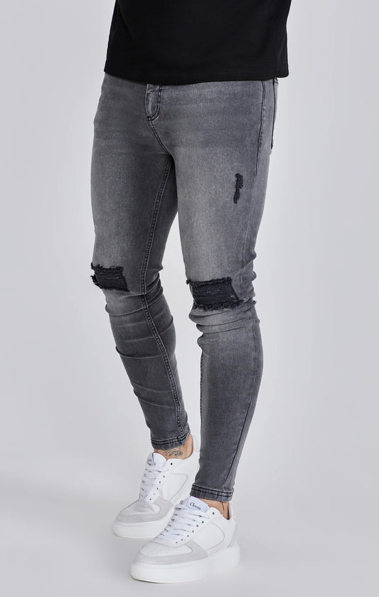 Jeans delgados angustiados grises Siksilk