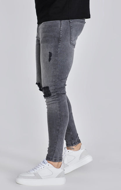 Jeans delgados angustiados grises Siksilk