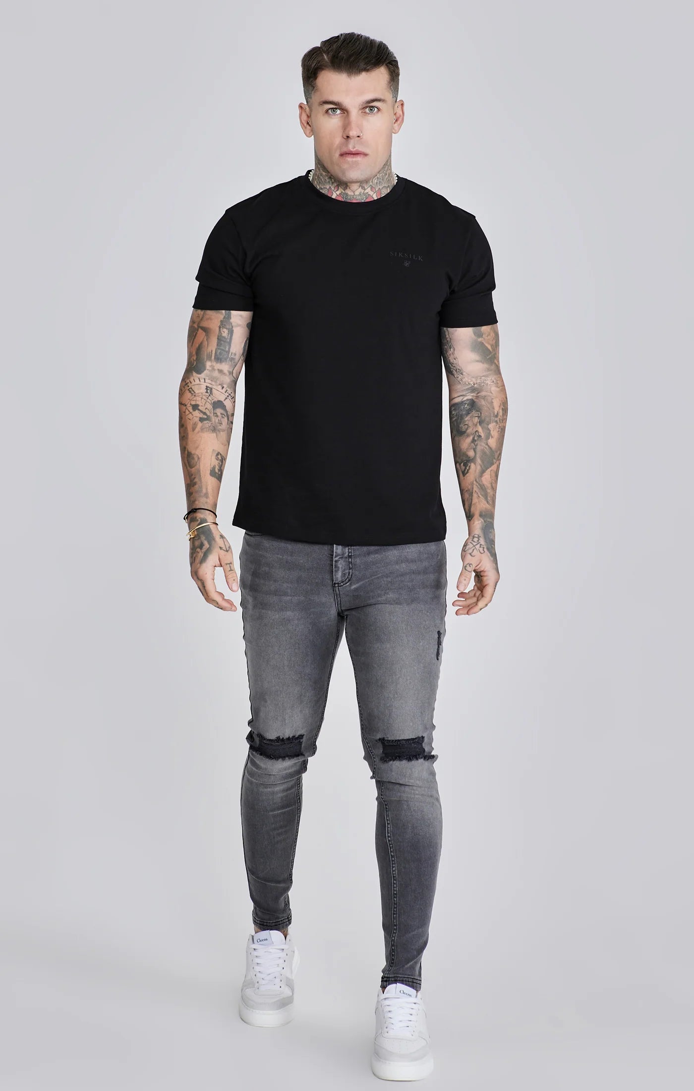 Jeans delgados angustiados grises Siksilk